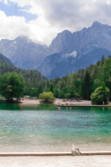 Fototapeta na wymiar clean transparent cold turquoise water of Jasna lake pearl of Slovenian alpine sights