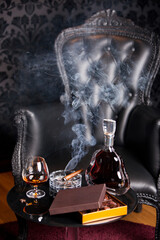 Leather armchair cognac and cigar