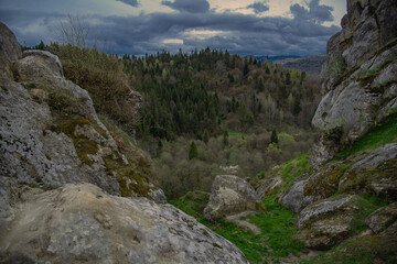 High perspective view of the mountains during sunset. Some mountain peaks. The concept of landscape and nature.