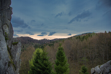 High perspective view of the mountains during sunset. Some mountain peaks. The concept of landscape and nature.