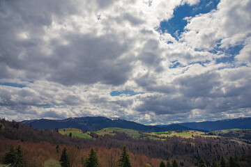 High perspective view of the mountains during sunset. Some mountain peaks. The concept of landscape and nature.