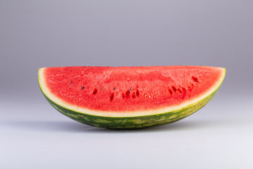 a quarter slice of watermelon isolated on a white background with clipping path.