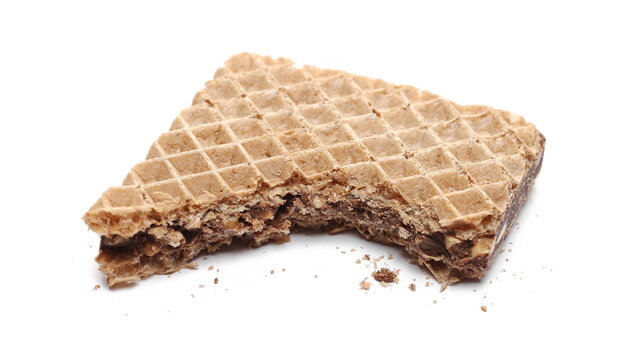 Hazelnut chocolate wafer slice, bar bitten in half with crumbs isolated on white background