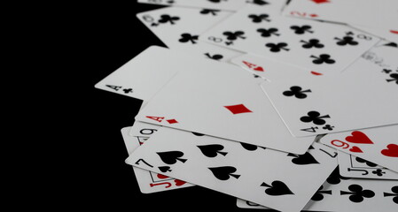 Playing cards for poker and gambling, isolated on black background, clipping path