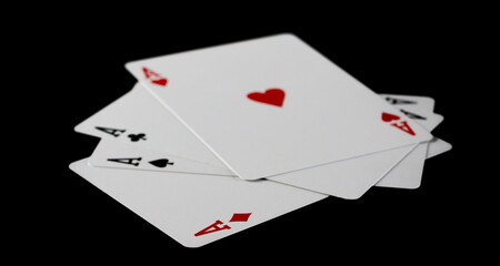 Aces, poker and gambling playing cards, isolated on black background, clipping path