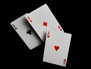 Aces, poker and gambling playing cards, isolated on black background, clipping path