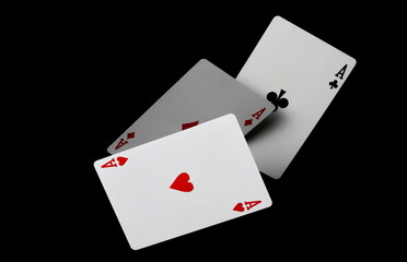 Aces, poker and gambling playing cards, isolated on black background, clipping path
