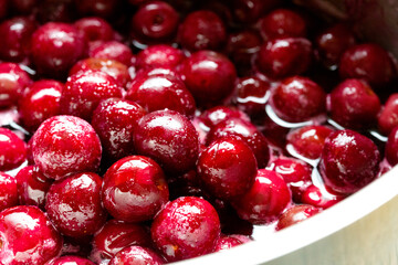 Cherries with pits in sugar syrup.