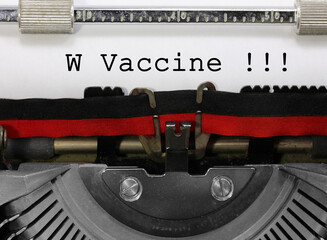 Phrase W Vaccine writen with an old vintage typewriter