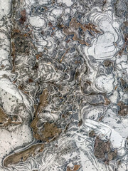 Frozen ice on sidewalk