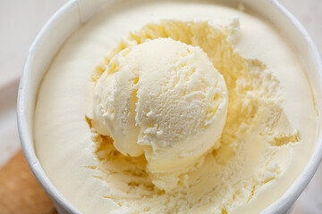 Close up of white ice cream scoops inpaper box