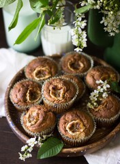 banana muffins in a plate on a wooden background in rustic style. Viennese cookies with berries. proper nutrition, organic food, healthy food, seasonal food, festive, holidays, children's concept.