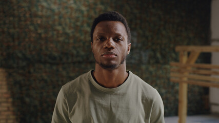 Black soldier in gym of military base