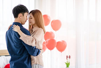 Asian couple dancing during date