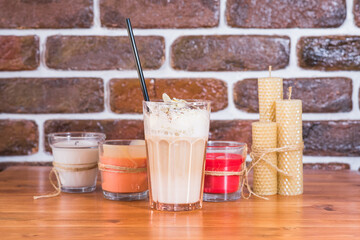Delicious coffee latte bounty in a glass on a wooden table