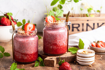 Strawberry chia pudding in glass jars.