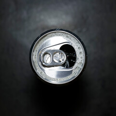 view of the top of a soda can with black background