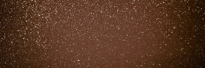 Brown glitter bokeh circle glow blurred and blur abstract. Glittering shimmer bright luxury . White and silver glisten twinkle for texture wallpaper and background backdrop.
