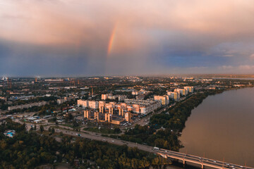 Rainbow is double in the most of photo. Beautiful double rainbow in the city after the rain. Photos taken from the drone