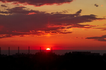background of red dramatic beautiful sunset over the city