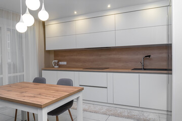 Beautiful modern minimalistic interior of a bright kitchen