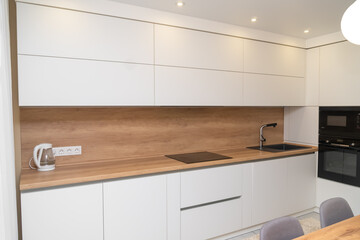 Modern minimalistic interior of a bright kitchen
