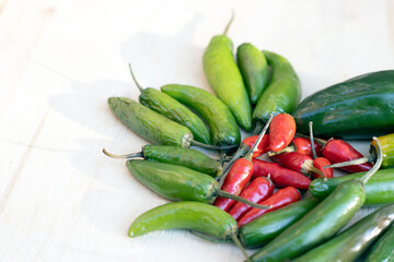 Chilies on a light wooden board