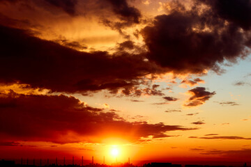 Fototapeta premium background of red dramatic beautiful sunset over the city