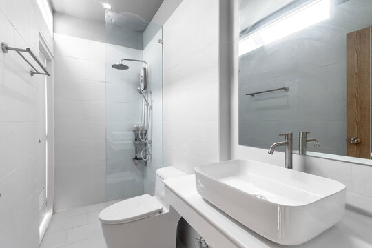 basin and facility of white bathroom interior 