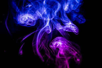 Colored smoke on black background