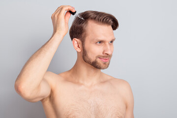 Photo of sweet pretty blond hair young guy no clothes smiling holding arm oil dropper looking empty...
