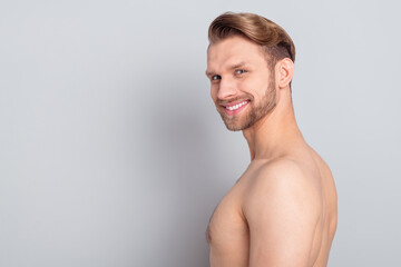 Naklejka premium Profile side view portrait of attractive naked cheerful man copy space complexion isolated over grey pastel color background