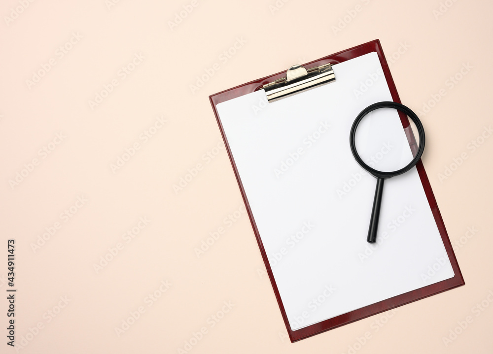 Poster folder with blank white sheets and a black magnifier on a beige background. background for inscripti