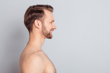 Profile photo of sexy blond hairdo guy look empty space without clothes isolated on grey color background