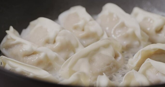 Grill dumpling in pan at kitchen