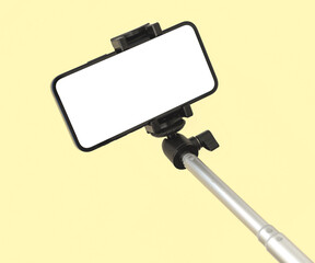 Mobile phone and selfie stick mockup for travel and fashion, beauty template colorful pastel background, copy space photo