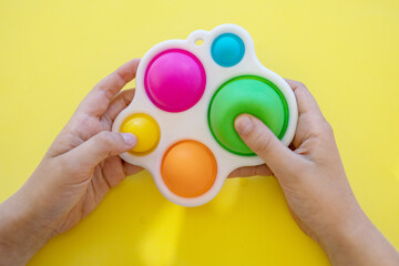 colorful antistress sensory toy fidget push pop it in kid's hands