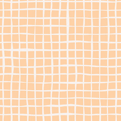 Seamless plaid pattern with white hand drawn doodle lines on a yellow background. Abstract boho texture in retro style for wrapping paper, covers and fabric.