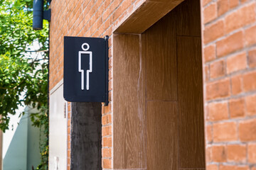 Men public toilet sign In the garden thailand.