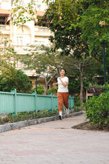 Fototapeta na wymiar Young woman jogging in park at morning.