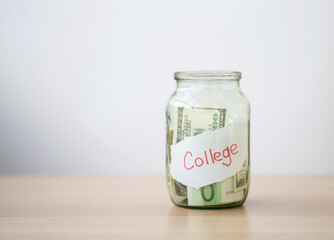 Glass jar with money with the inscription - college.