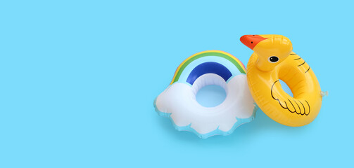 Inflatable rings on blue background. Summer background concept
