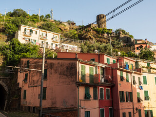 Cinque Terre National Park in Italy with old buildings on hill. Sunny landscape during the holidays.