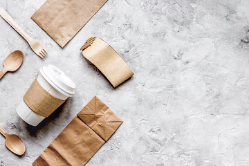 food delivery workdesk with paper bags and plastic cup table background top view mock-up