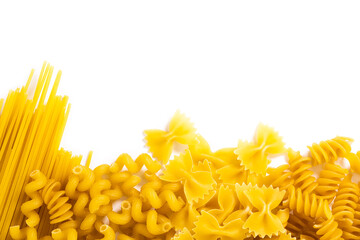 Variety of types and shapes of Italian pasta on white background. Top view with copy space