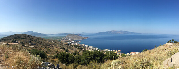 Fototapeta premium Panorama of the city near the sea, view of the sea bay, mountains and resort town