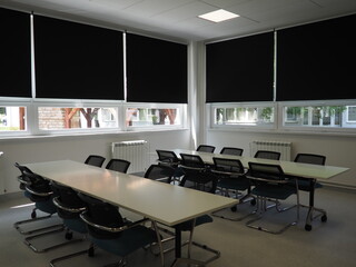 table and chairs in the meeting room in the office, in the classroom or in the library hall. White,...