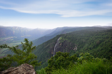 Spectacular view of a mountain and the waterfall during monsoon. A scenic site from Munar, Kerala, India.