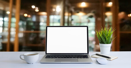 Front view of open laptop computer notebook with blank monitor white screen display on work table...