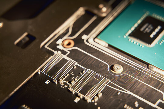 Computers video card with an empty space for memory chips. GPU without chip in GDDR memory slot. Concept for worldwide semiconductors and chips shortage. High prices on GDDR6, HBM2 and GDDR6x .